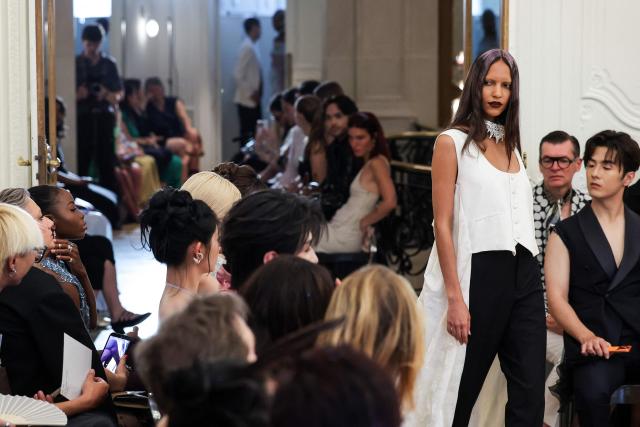 A model presents a creation by Peet Dullaert for the Women Haute Couture Fall/Winter 2026-2027 collection fashion show as part of the Paris Fashion Week, in Paris, on July 9, 2026. (Photo by Kenzo TRIBOUILLARD / AFP)