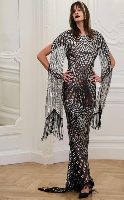 A model presents a creation by Peet Dullaert for the Women Haute Couture Fall/Winter 2026-2027 collection fashion show as part of the Paris Fashion Week, in Paris, on July 9, 2026. (Photo by Kenzo TRIBOUILLARD / AFP)