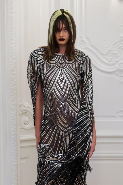 A model presents a creation by Peet Dullaert for the Women Haute Couture Fall/Winter 2026-2027 collection fashion show as part of the Paris Fashion Week, in Paris, on July 9, 2026. (Photo by Kenzo TRIBOUILLARD / AFP)