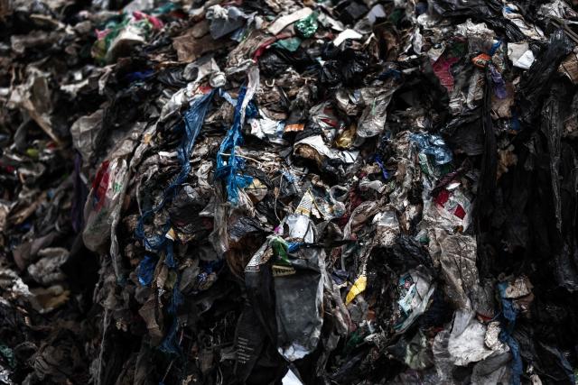 This photograph shows non-reusable waste awaiting processing at the ALTèreNATIVE plant, the French largest production facility for Solid Recovered Fuel (SRF) in Martigues, south-eastern France on July 9, 2026. Once processed, the waste will be used as fuel in cement plants. (Photo by Thibaud MORITZ / AFP)