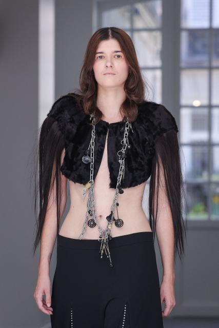 A model presents a creation for Aelis for the Women Haute Couture Fall/Winter 2026-2027 collection as part of the Paris Fashion Week, in Paris, on July 9, 2026. (Photo by Kenzo TRIBOUILLARD / AFP)