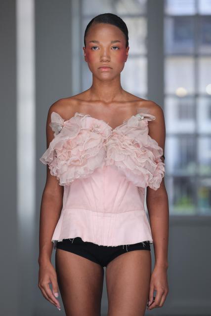 A model presents a creation for Aelis for the Women Haute Couture Fall/Winter 2026-2027 collection as part of the Paris Fashion Week, in Paris, on July 9, 2026. (Photo by Kenzo TRIBOUILLARD / AFP)