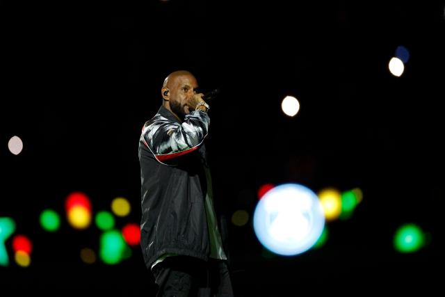 (FILES) French rapper Booba performs ahead of the French L1 football match between Paris Saint-Germain (PSG) and Olympique de Marseille (OM) at the Parc des Princes stadium in Paris on February 8, 2026. The Paris court on July 9, 2026 ordered the withdrawal of the ruling that had authorized the provisional seizure of 40 million euros from Booba's copyright royalties, a measure obtained by influencer agent Magali Berdah, according to a decision seen by AFP. (Photo by GEOFFROY VAN DER HASSELT / AFP)