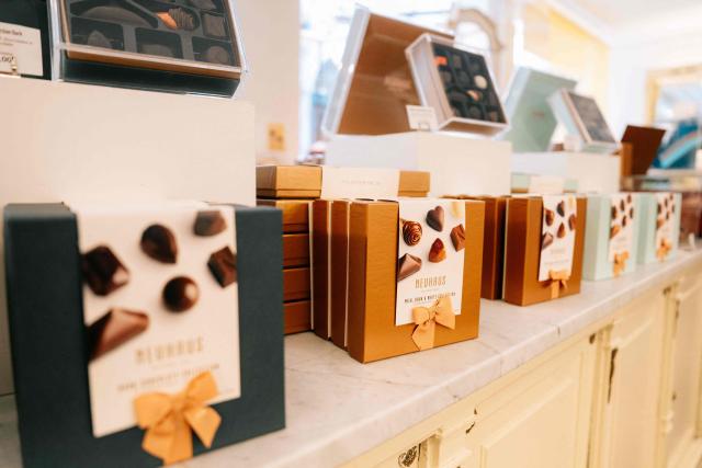 This photograph shows displayed chocolate boxes at a Neuhaus chocolatier shop of the Koninginnegalerij - Galerie de la Reine, in the city center of Brussels on July 9, 2026. (Photo by Marius BURGELMANS / Belga / AFP) / Belgium OUT