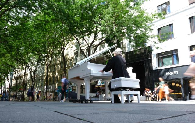 Music professor of Fukuoka University Fukuda Nobumitsu who lives in Vienna, plays a piano free to play for everybody at Mariahilfer street in Vienna, Austria, on July 09, 2026. (Photo by Joe KLAMAR / AFP)