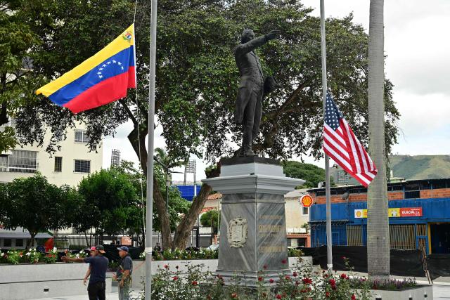 View of the Venezuelan and the US flags flying at half-mast at the Washington square in Caracas on July 9, 2026, following the June 24 twin earthquakes. The United Nations launched an urgent appeal on July 8, 2026 for nearly $300 million towards Venezuela earthquake relief operations as the death toll from the disaster rose to more than 3,800 people. (Photo by MARTIN BERNETTI / AFP)