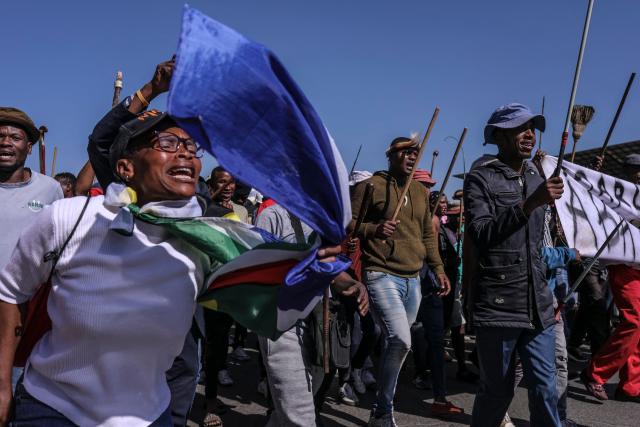 Protesters chant slogans during an anti immigrant march in Alexandra, on July 9, 2026. (Photo by MZINGENKOSI SIBANDA / AFP)
