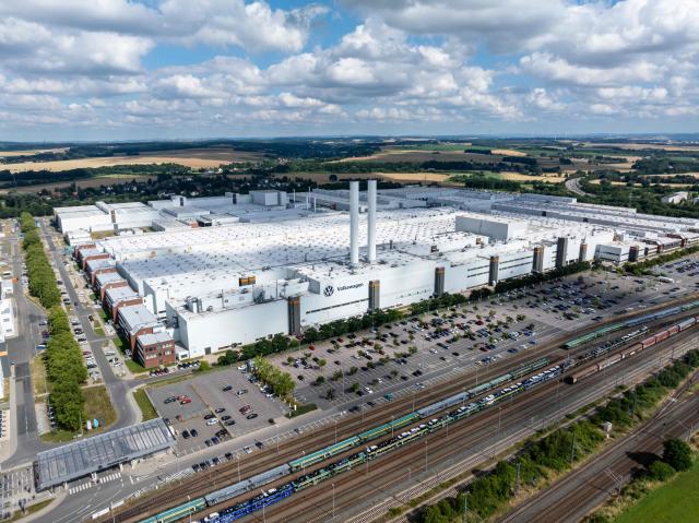 Clouds gather over the Zwickau Volkswagen Plant on July 9, 2026 at the Zwickau, eastern Germany. Volkswagen workers staged protests nationwide on July 9 as unions warned of "major conflict" if the struggling German car giant pushes ahead with what could be the global auto industry's biggest restructuring. (Photo by AFP)