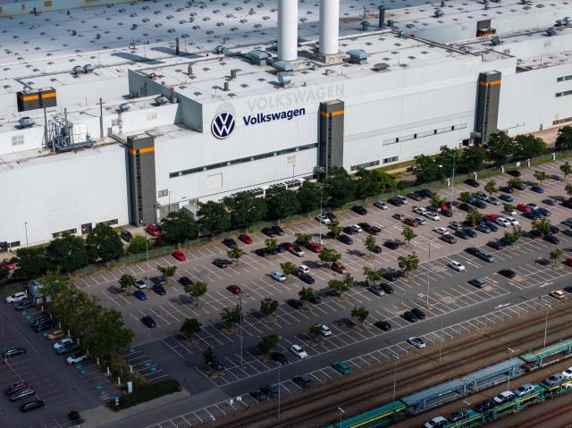 Clouds gather over the Zwickau Volkswagen Plant on July 9, 2026 at the Zwickau, eastern Germany. - AFP PHOTO / STR. Volkswagen workers staged protests nationwide on July 9 as unions warned of "major conflict" if the struggling German car giant pushes ahead with what could be the global auto industry's biggest restructuring. (Photo by AFP)
