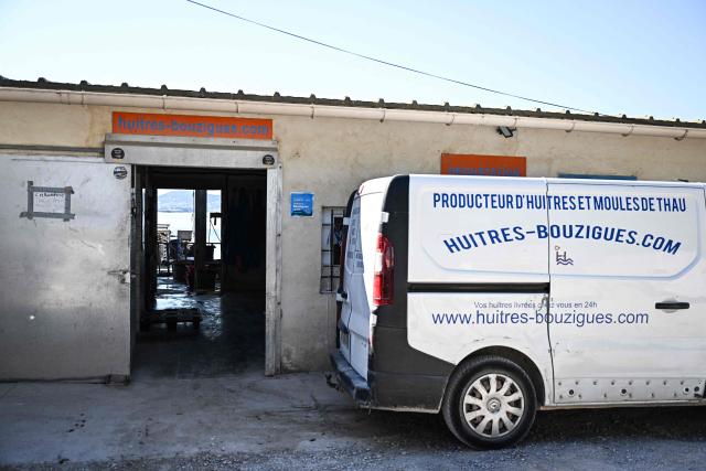 This photograph shows an external view of a building of Huitres de Bouzigues' farm, on the Etang de Thau in Loupian, southern France, on July 9, 2026. (Photo by Gabriel BOUYS / AFP)