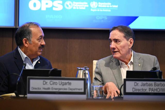(L-R) PAHO health emergencies director Dr. Ciro Ugarte and PAHO Director Dr. Jarbas Barbosa, speak during a briefing on the health response to the earthquakes in Venezuela, at the Pan American Health Organization (PAHO) headquarters in Washington, DC, on July 9, 2026. (Photo by Drew ANGERER / AFP)