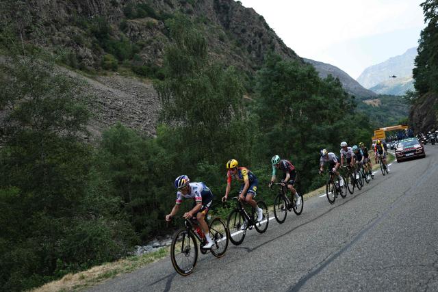 Red Bull - BORA - hansgrohe team's Belgian rider Remco Evenepoel leads a pursuing group of riders in the final kilometers of the 6th stage of the 113th edition of the Tour de France cycling race, 186 km between Pau and Gavarnie-Gèdre in the French Pyrenees, on July 9, 2026. (Photo by Anne-Christine POUJOULAT / AFP)