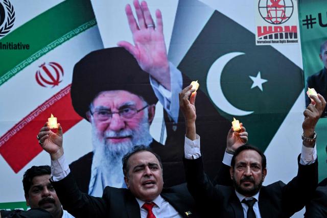 International Human Rights Movement participants light candles in solidarity with Iran's slain supreme leader Ali Khamenei and members of his family during a ceremony in Lahore on July 9, 2026. (Photo by Arif ALI / AFP)