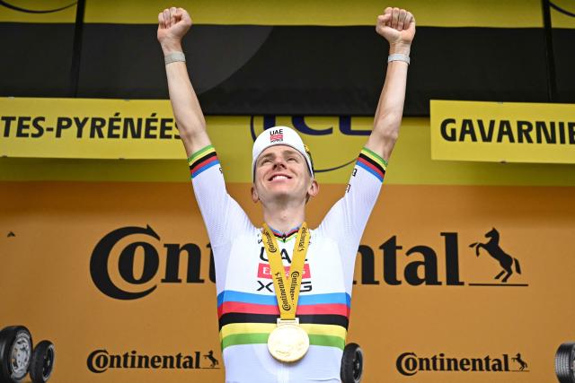 UAE Team Emirates - XRG's Slovenian rider Tadej Pogacar celebrates on the podium after winning the 6th stage of the 113th edition of the Tour de France cycling race, 186 km between Pau and Gavarnie-Gèdre in the French Pyrenees, on July 9, 2026. (Photo by Loic VENANCE / AFP)