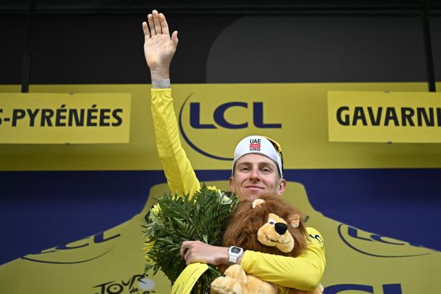 UAE Team Emirates - XRG's Slovenian rider Tadej Pogacar celebrates on the podium with the overall leader's yellow jersey after the 6th stage of the 113th edition of the Tour de France cycling race, 186 km between Pau and Gavarnie-Gèdre in the French Pyrenees, on July 9, 2026. (Photo by Loic VENANCE / AFP)