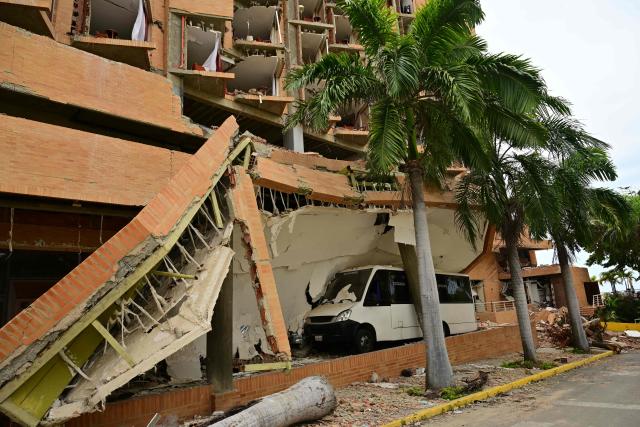 View of the destroyed Marriot Hotel in Playa Grande, Catia La Mar, La Guaira state, Venezuela on July 9, 2026, following the June 24 twin earthquakes. The United Nations launched an urgent appeal on July 8, 2026 for nearly $300 million towards Venezuela earthquake relief operations as the death toll from the disaster rose to more than 3,800 people. (Photo by MARTIN BERNETTI / AFP)
