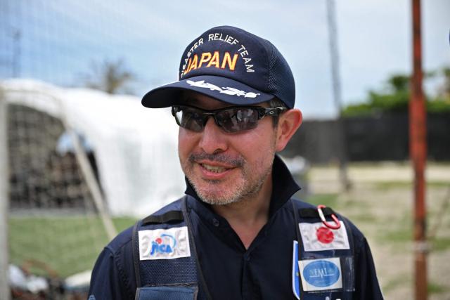 Roberto Kido, diplomat and leader of national and international emergency response of Japan, speaks with AFP at Japan's military field hospital in Caribe, La Guaira state, Venezuela on July 9, 2026, following the June 24 twin earthquakes. The United Nations launched an urgent appeal on July 8, 2026 for nearly $300 million towards Venezuela earthquake relief operations as the death toll from the disaster rose to more than 3,800 people. (Photo by Raul ARBOLEDA / AFP)