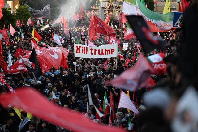 Crowds of mourners gather on a street ahead of the funeral procession of Iran's slain supreme leader Ali Khamenei and members of his family, before he is buried at the Shrine of Imam Reza, Iran's most revered place of worship, in Mashhad on July 9, 2026. Calling for revenge and rejecting any compromise with the West, Iranians loyal to the Islamic republic braved sweltering heat on July 9 to mass for the burial of supreme leader Ali Khamenei in his hometown of Mashhad. (Photo by Wakil Kohsar / AFP) / 
