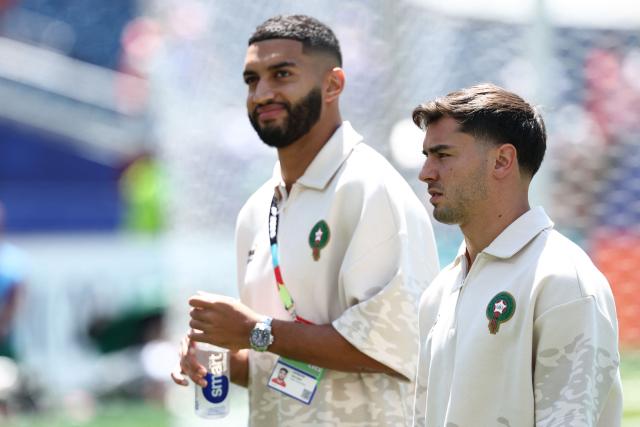 Morocco's midfielder #11 Ismael Saibari and forward #10 Brahim Diaz walk on the pitch ahead of the 2026 World Cup football tournament quarter-final match between France and Morocco at Boston Stadium in Foxborough on July 9, 2026.  (Photo by FRANCK FIFE / AFP)