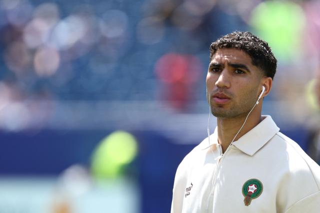 Morocco's defender #02 Achraf Hakimi walks on the pitch ahead of the 2026 World Cup football tournament quarter-final match between France and Morocco at Boston Stadium in Foxborough on July 9, 2026.  (Photo by FRANCK FIFE / AFP)