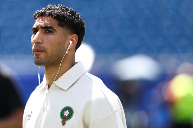 Morocco's defender #02 Achraf Hakimi walks on the pitch ahead of the 2026 World Cup football tournament quarter-final match between France and Morocco at Boston Stadium in Foxborough on July 9, 2026.  (Photo by FRANCK FIFE / AFP)