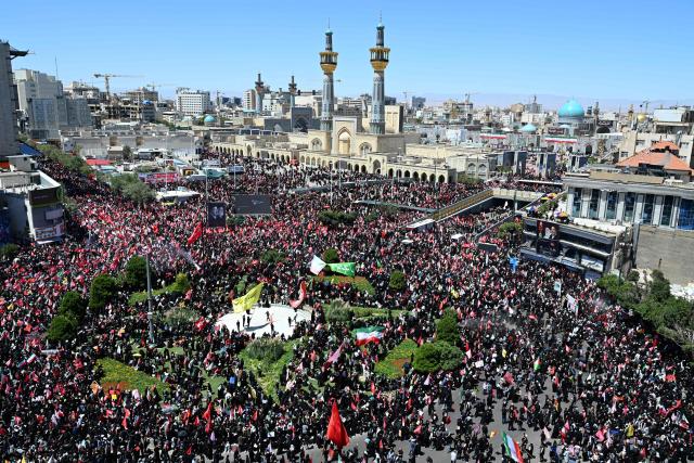 Crowds of mourners gather ourside the Shrine of Imam Reza, Irans most revered place of worship, ahead of the funeral procession of Iran's slain supreme leader Ali Khamenei and members of his family in Mashhad on July 9, 2026. Calling for revenge and rejecting any compromise with the West, Iranians loyal to the Islamic republic braved sweltering heat on July 9 to mass for the burial of supreme leader Ali Khamenei in his hometown of Mashhad. (Photo by Wakil Kohsar / AFP) / 