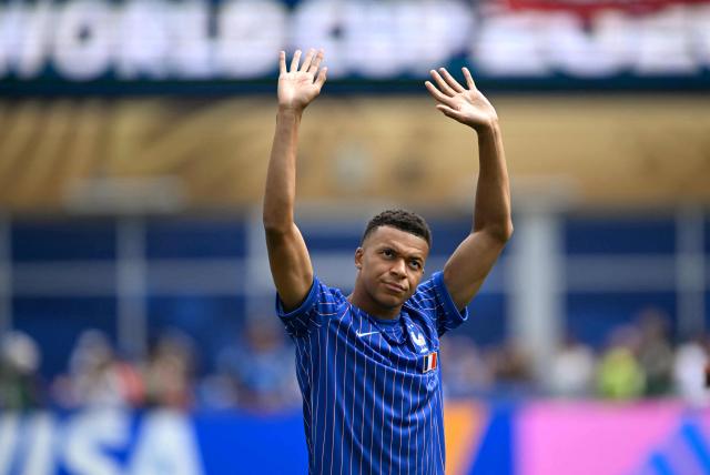 France's forward #10 Kylian Mbappe waves to the crowd ahead of the 2026 World Cup football tournament quarter-final match between France and Morocco at Boston Stadium in Foxborough on July 9, 2026.  (Photo by MAURO PIMENTEL / AFP)