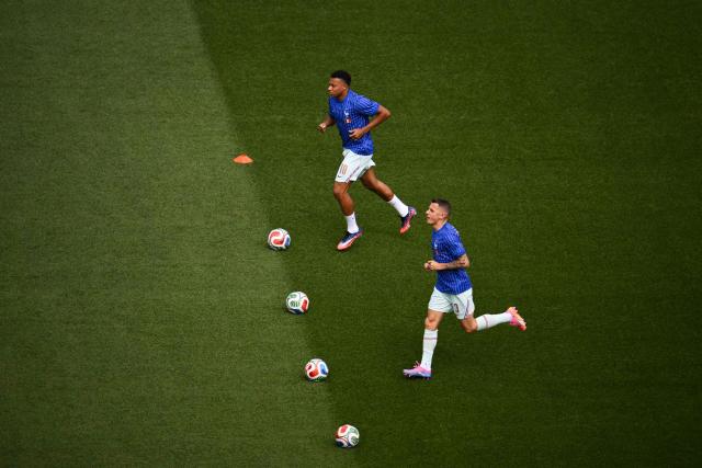 France's forward #10 Kylian Mbappe and France's defender #03 Lucas Digne warm up ahead of the 2026 World Cup football tournament quarter-final match between France and Morocco at Boston Stadium in Foxborough on July 9, 2026.  (Photo by ANGELA WEISS / AFP)