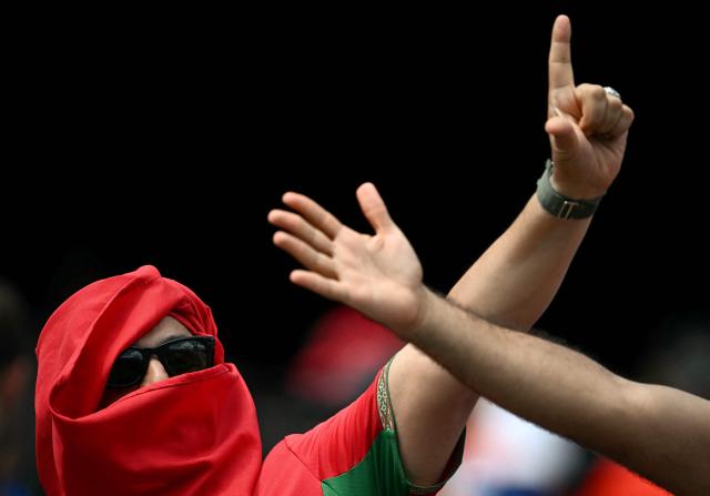 A Moroccan fan cheers ahead of the 2026 World Cup football tournament quarter-final match between France and Morocco at Boston Stadium in Foxborough on July 9, 2026.  (Photo by MAURO PIMENTEL / AFP)