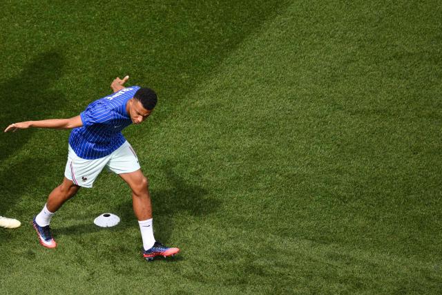France's forward #10 Kylian Mbappe warms up ahead of the 2026 World Cup football tournament quarter-final match between France and Morocco at Boston Stadium in Foxborough on July 9, 2026.  (Photo by ANGELA WEISS / AFP)
