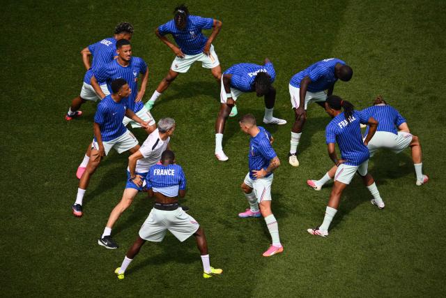 France's forward #10 Kylian Mbappe and teammates warm up ahead of the 2026 World Cup football tournament quarter-final match between France and Morocco at Boston Stadium in Foxborough on July 9, 2026.  (Photo by ANGELA WEISS / AFP)