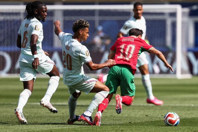 Morocco's forward #10 Brahim Diaz (R) falls past France's forward #20 Desire Doue during the 2026 World Cup football tournament quarter-final match between France and Morocco at Boston Stadium in Foxborough on July 9, 2026.  (Photo by FRANCK FIFE / AFP)