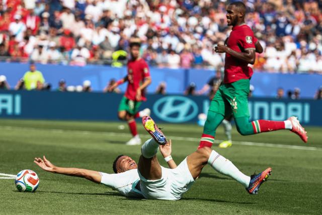 France's forward #10 Kylian Mbappe is fouled by Morocco's defender #03 Noussair Mazraoui during the 2026 World Cup football tournament quarter-final match between France and Morocco at Boston Stadium in Foxborough on July 9, 2026.  (Photo by FRANCK FIFE / AFP)