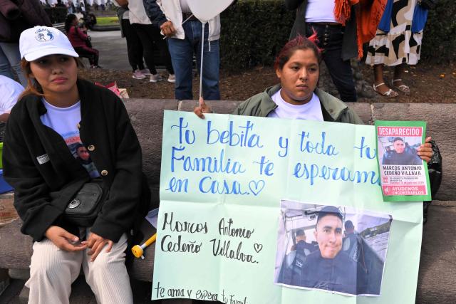 Relatives of one of five security guards who disappeared in mid-June on the high seas hold a sing during a sit-in to demand the government to intensify their search, outside the Carondelet Palace, in Quito on July 9, 2026. (Photo by Rodrigo BUENDIA / AFP)