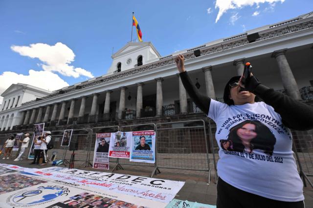 Family members and friends of five security guards who disappeared in mid-June on the high seas hold a sit-in to demand the government to intensify their search, outside the Carondelet Palace, in Quito on July 9, 2026. (Photo by Rodrigo BUENDIA / AFP)