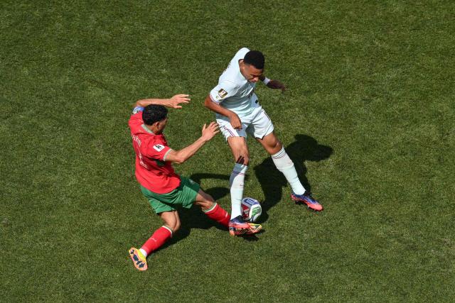 France's forward #10 Kylian Mbappe and Morocco's defender #02 Achraf Hakimi fight for the ball during the 2026 World Cup football tournament quarter-final match between France and Morocco at Boston Stadium in Foxborough on July 9, 2026.  (Photo by ANGELA WEISS / AFP)