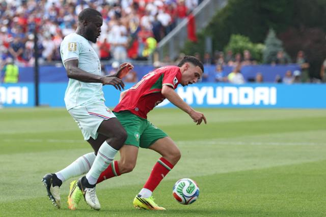 France's defender #04 Dayot Upamecano AND Morocco's midfielder #23 Bilal El Khannouss fight for the ball during the 2026 World Cup football tournament quarter-final match between France and Morocco at Boston Stadium in Foxborough on July 9, 2026.  (Photo by Odd ANDERSEN / AFP)