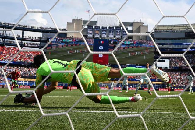 Morocco's goalkeeper #01 Yassine Bounou saves a penalty kick by France's forward #10 Kylian Mbappe during the 2026 World Cup football tournament quarter-final match between France and Morocco at Boston Stadium in Foxborough on July 9, 2026.  (Photo by MAURO PIMENTEL / AFP)