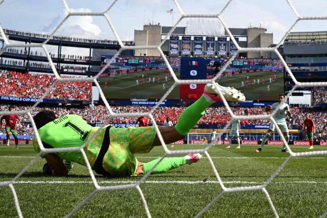 Morocco's goalkeeper #01 Yassine Bounou saves a penalty kick by France's forward #10 Kylian Mbappe during the 2026 World Cup football tournament quarter-final match between France and Morocco at Boston Stadium in Foxborough on July 9, 2026.  (Photo by MAURO PIMENTEL / AFP)