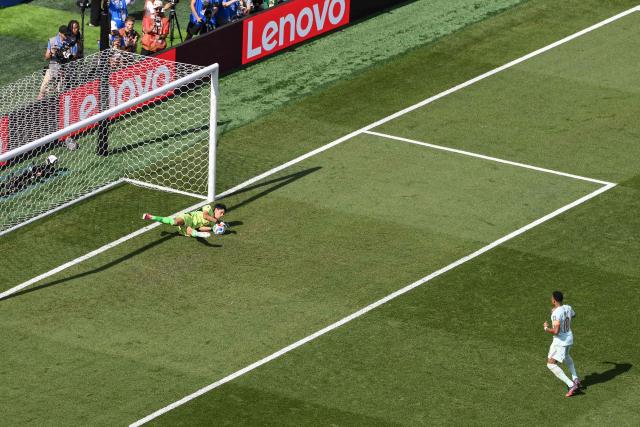Morocco's goalkeeper #01 Yassine Bounou saves a penalty kick by France's forward #10 Kylian Mbappe during the 2026 World Cup football tournament quarter-final match between France and Morocco at Boston Stadium in Foxborough on July 9, 2026.  (Photo by ANGELA WEISS / AFP)