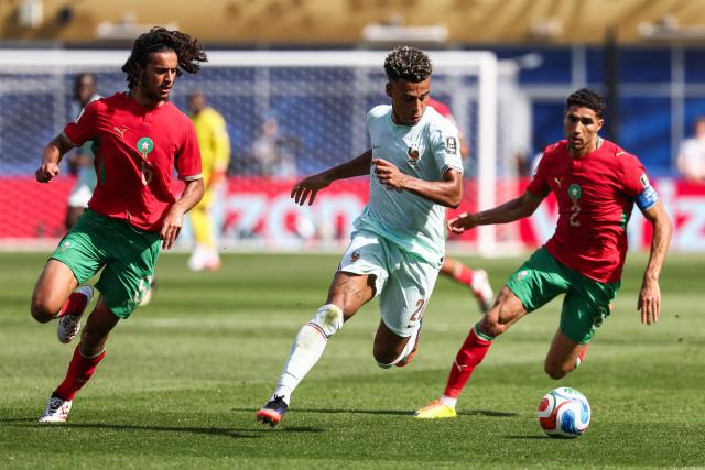 Morocco's midfielder #06 Ayyoub Bouaddi, France's forward #20 Desire Doue, and Morocco's defender #02 Achraf Hakimi fight for the ball during the 2026 World Cup football tournament quarter-final match between France and Morocco at Boston Stadium in Foxborough on July 9, 2026.  (Photo by FRANCK FIFE / AFP)