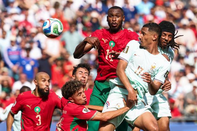 France's defender #17 William Saliba heads the ball past Morocco's defender #14 Issa Diop during the 2026 World Cup football tournament quarter-final match between France and Morocco at Boston Stadium in Foxborough on July 9, 2026.  (Photo by FRANCK FIFE / AFP)