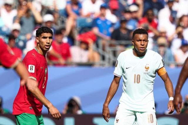 Morocco's defender #02 Achraf Hakimi and France's forward #10 Kylian Mbappe react during the 2026 World Cup football tournament quarter-final match between France and Morocco at Boston Stadium in Foxborough on July 9, 2026.  (Photo by FRANCK FIFE / AFP)
