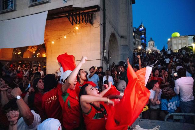Football fans including some with the Morocco jersy watch the 2026 World Cup quarter final football match between France and Morocco in the city center of Brussels, on July 9 2026. (Photo by Marius BURGELMANS / Belga / AFP) / Belgium OUT