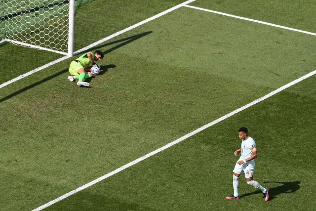 Morocco's goalkeeper #01 Yassine Bounou saves a penalty kick by France's forward #10 Kylian Mbappe during the 2026 World Cup football tournament quarter-final match between France and Morocco at Boston Stadium in Foxborough on July 9, 2026.  (Photo by ANGELA WEISS / AFP)