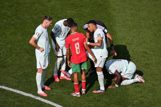 France's forward #10 Kylian Mbappe speaks to Morocco's midfielder #08 Azzedine Ounahi during the 2026 World Cup football tournament quarter-final match between France and Morocco at Boston Stadium in Foxborough on July 9, 2026.  (Photo by ANGELA WEISS / AFP)