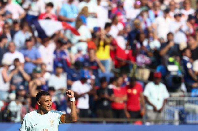 France's forward #10 Kylian Mbappe celebrates scoring his team's first goal during the 2026 World Cup football tournament quarter-final match between France and Morocco at Boston Stadium in Foxborough on July 9, 2026.  (Photo by FRANCK FIFE / AFP)