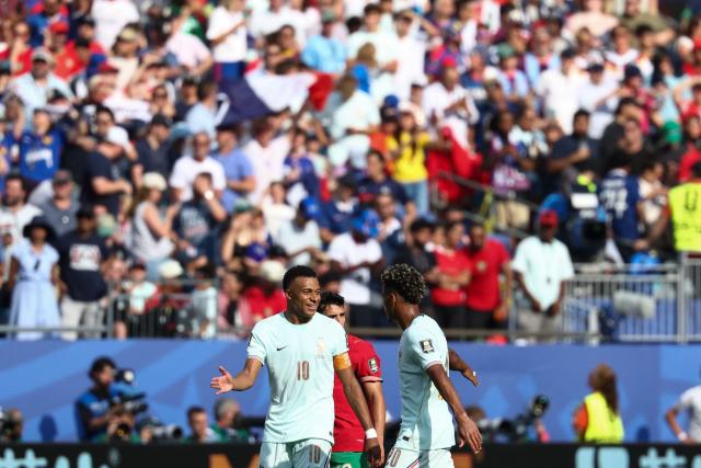 France's forward #10 Kylian Mbappe celebrates scoring his team's first goal with teammate forward #20 Desire Doue during the 2026 World Cup football tournament quarter-final match between France and Morocco at Boston Stadium in Foxborough on July 9, 2026.  (Photo by FRANCK FIFE / AFP)