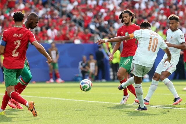 France's forward #10 Kylian Mbappe kicks the ball and scores his team's first goal during the 2026 World Cup football tournament quarter-final match between France and Morocco at Boston Stadium in Foxborough on July 9, 2026.  (Photo by Odd ANDERSEN / AFP)