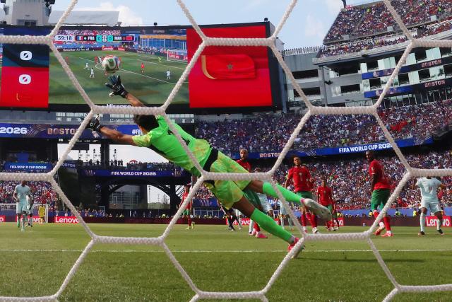 Morocco's goalkeeper #01 Yassine Bounou concedes a goal scored by France's forward #10 Kylian Mbappe and his team's first goal during the 2026 World Cup football tournament quarter-final match between France and Morocco at Boston Stadium in Foxborough on July 9, 2026.  (Photo by CHARLY TRIBALLEAU / AFP)